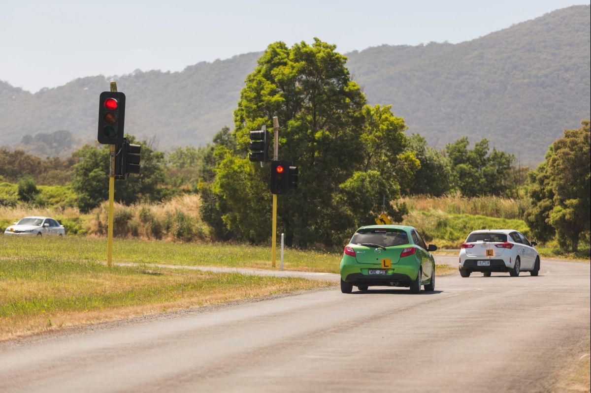 Green Mazda Learner At Lights